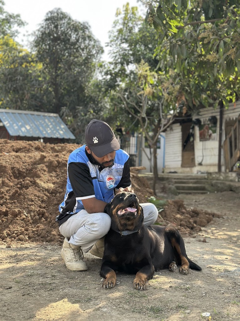 Sumit, Head Trainer, with a dog